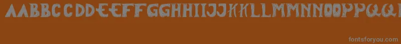 フォントTersesat – 茶色の背景に灰色の文字