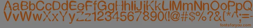 フォントExpression – 茶色の文字が灰色の背景にあります。