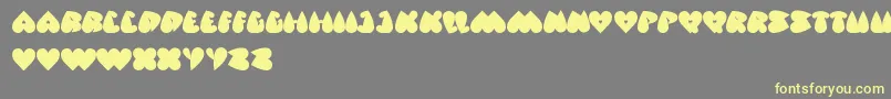 フォントValentineDays – 黄色のフォント、灰色の背景
