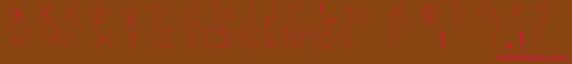 フォントTipografia.Zombie. – 赤い文字が茶色の背景にあります。