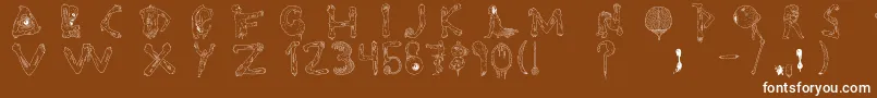 Tipografia.Zombie.-Schriftart – Weiße Schriften auf braunem Hintergrund