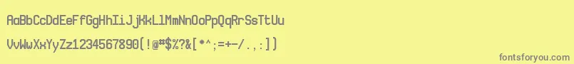 フォントNovamono – 黄色の背景に灰色の文字