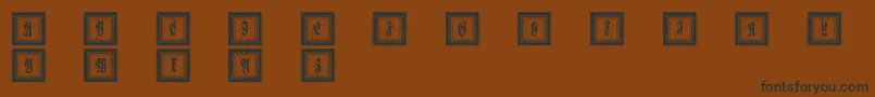Framedfraxcaps Font – Black Fonts on Brown Background