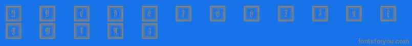 Framedfraxcaps-Schriftart – Graue Schriften auf blauem Hintergrund