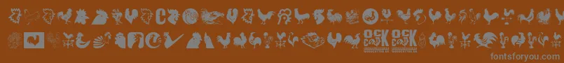 Cock-Schriftart – Graue Schriften auf braunem Hintergrund