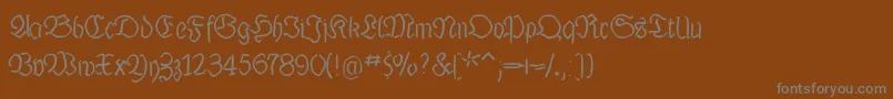 Luthermousedrawn-Schriftart – Graue Schriften auf braunem Hintergrund