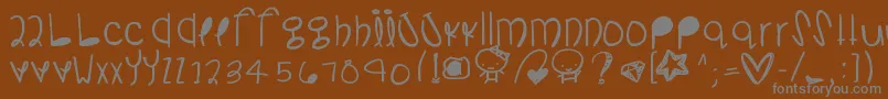 Somanydetails-fontti – harmaat kirjasimet ruskealla taustalla