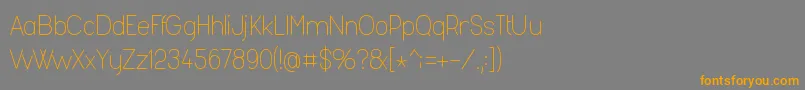 フォントFashl954 – オレンジの文字は灰色の背景にあります。