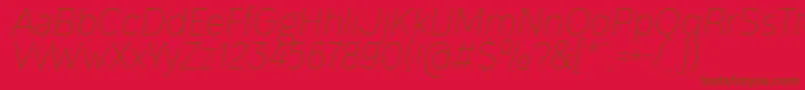 OgonekLightItalic-Schriftart – Braune Schriften auf rotem Hintergrund