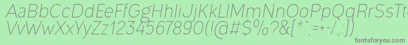 Fonte OgonekLightItalic – fontes cinzas em um fundo verde