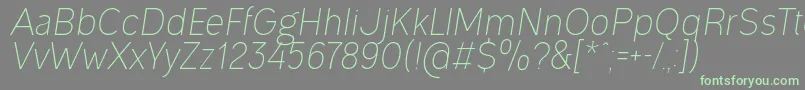 フォントOgonekLightItalic – 灰色の背景に緑のフォント