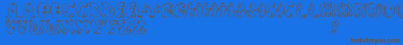フォントJmhPez – 茶色の文字が青い背景にあります。