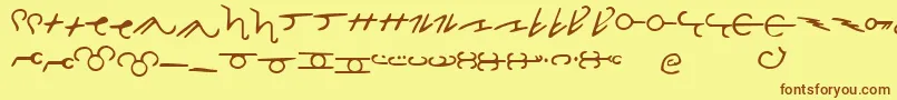 フォントThorassFrFont – 茶色の文字が黄色の背景にあります。