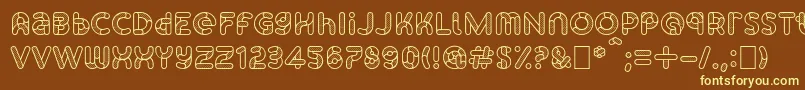 SkrovapartsOutlinedotted1-fontti – keltaiset fontit ruskealla taustalla