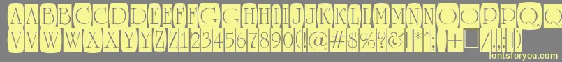 Шрифт ARomanusttlcmd2cb – жёлтые шрифты на сером фоне
