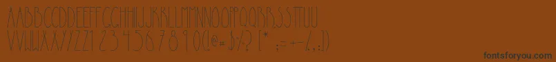 フォントLapiedrita – 黒い文字が茶色の背景にあります