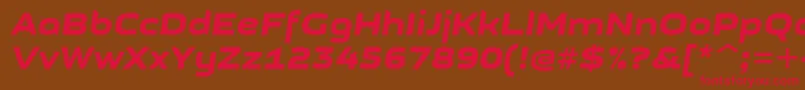 GetvoipGrotesqueItalic-fontti – punaiset fontit ruskealla taustalla