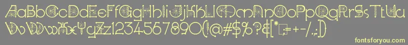 KingthingsSpirogyra-Schriftart – Gelbe Schriften auf grauem Hintergrund