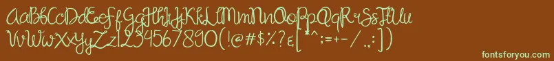フォントSandat – 緑色の文字が茶色の背景にあります。