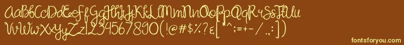 Sandat-fontti – keltaiset fontit ruskealla taustalla