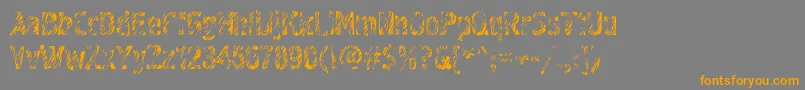 フォントGraffiti3c – オレンジの文字は灰色の背景にあります。