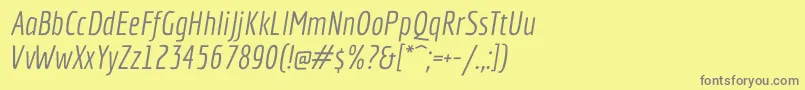 フォントEconomicaItalic – 黄色の背景に灰色の文字