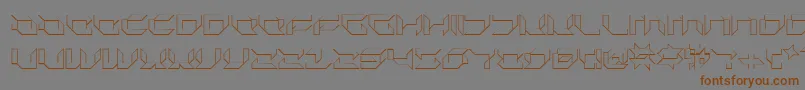 フォントPlurs – 茶色の文字が灰色の背景にあります。