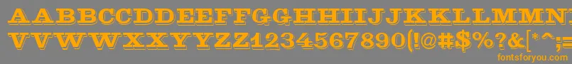 フォントGoldmine – オレンジの文字は灰色の背景にあります。