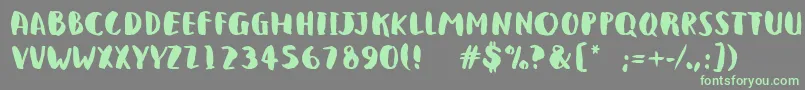 QlunkyBrushBold-Schriftart – Grüne Schriften auf grauem Hintergrund