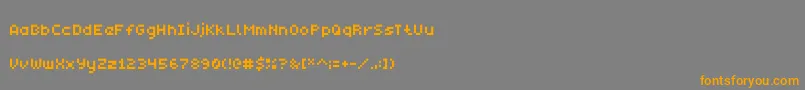 フォントMonobit – オレンジの文字は灰色の背景にあります。