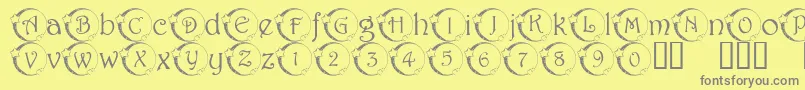 101StarLitNght-fontti – harmaat kirjasimet keltaisella taustalla