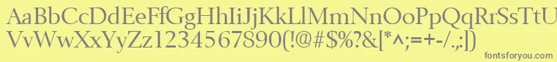 フォントBelfastRegular – 黄色の背景に灰色の文字