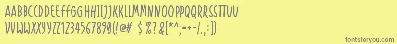 フォントHandapture – 黄色の背景に灰色の文字