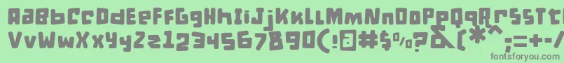 DPuntillasBToTiptoe Font – Gray Fonts on Green Background