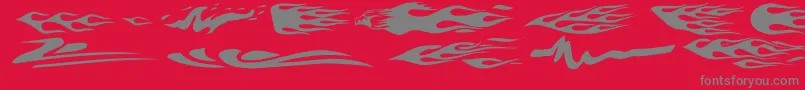 VehicleDecalsFlamesArt-fontti – harmaat kirjasimet punaisella taustalla