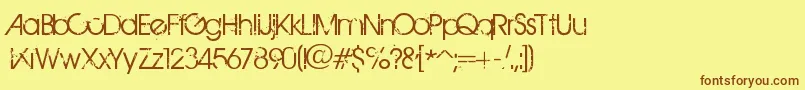 フォントBirthOfAHero – 茶色の文字が黄色の背景にあります。