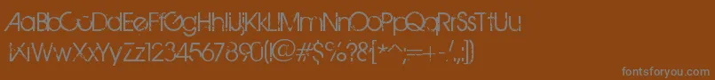 フォントBirthOfAHero – 茶色の背景に灰色の文字