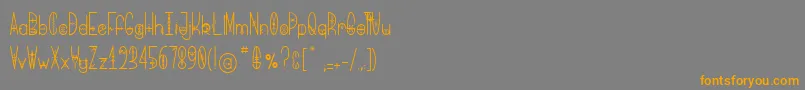 フォントBringMeThatGlyph – オレンジの文字は灰色の背景にあります。