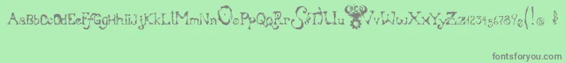 フォントBloodyIrishBastard – 緑の背景に灰色の文字