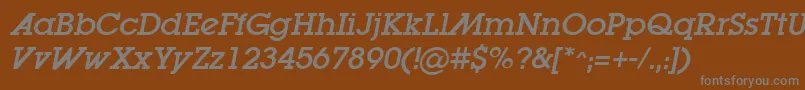 LugaadOblique-fontti – harmaat kirjasimet ruskealla taustalla