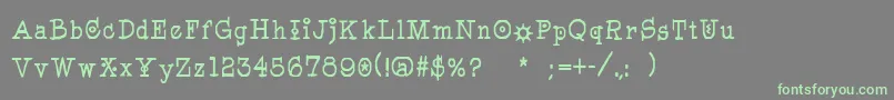 Pegyptienne-Schriftart – Grüne Schriften auf grauem Hintergrund