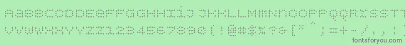 Bpdotsunicaseplus-fontti – harmaat kirjasimet vihreällä taustalla