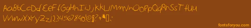 AnnieMax Font – Orange Fonts on Brown Background