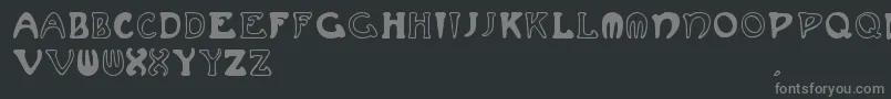 Muchafrenchcapitals-fontti – harmaat kirjasimet mustalla taustalla