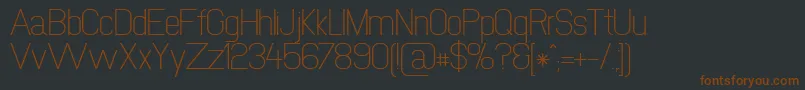 Newmedia-fontti – ruskeat fontit mustalla taustalla