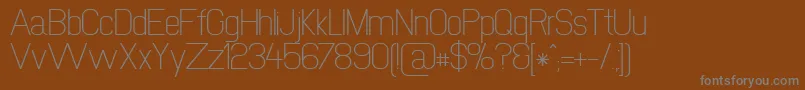 Newmedia Font – Gray Fonts on Brown Background