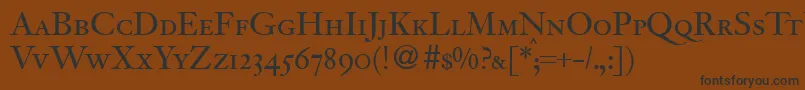 フォントJacobitesmcRegularDb – 黒い文字が茶色の背景にあります