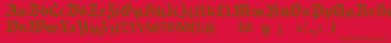 HermannGotischNormalc-fontti – ruskeat fontit punaisella taustalla