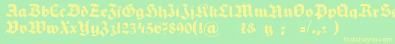 HermannGotischNormalc-Schriftart – Gelbe Schriften auf grünem Hintergrund