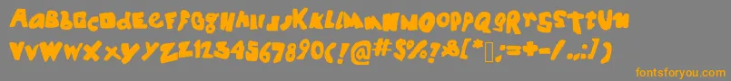 フォントSpookyhouse – オレンジの文字は灰色の背景にあります。